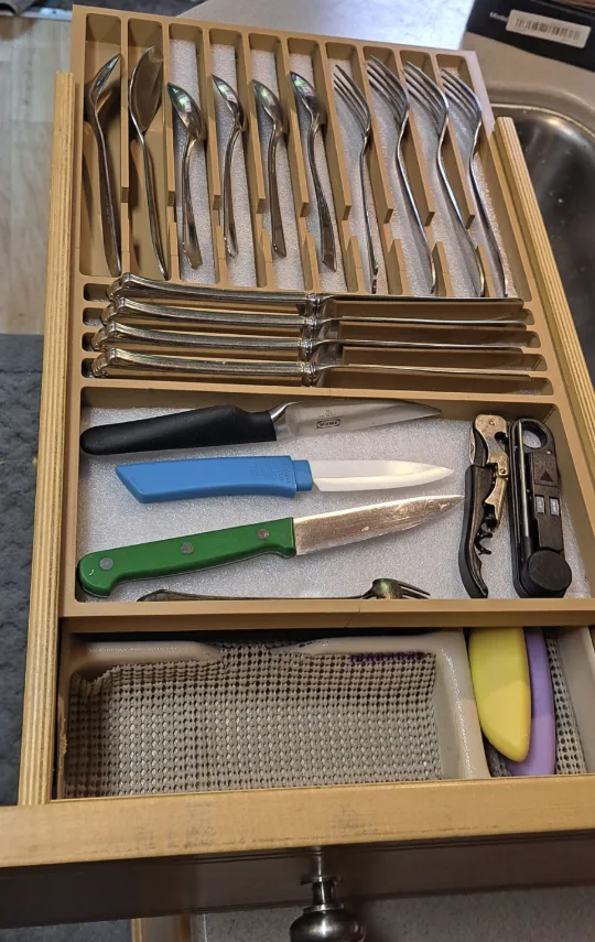 Custom 3D-printed silverware tray holding utensils and knives inside Bill’s RV drawer